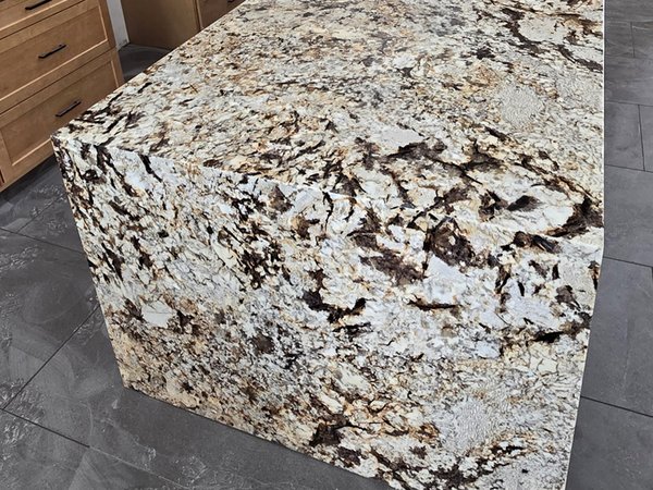 Waterfall granite kitchen island installed by Typhoon Builders